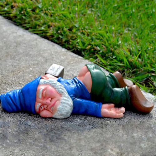  Funny garden gnome lying down as a gift